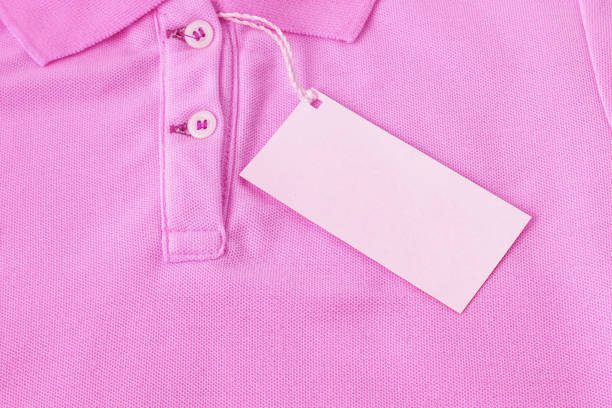 istock Blank tag label on pink shirt background. 1067238200