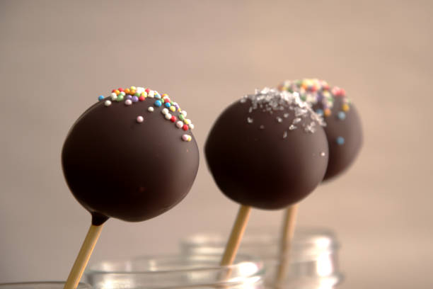 istock Three delicious chocolate cake pops in a jar. 1067238714