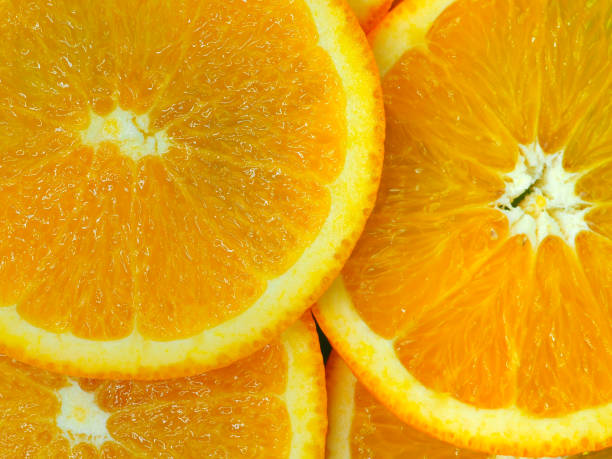 istock Summer fruits orange slice background, close up view. 1067258586