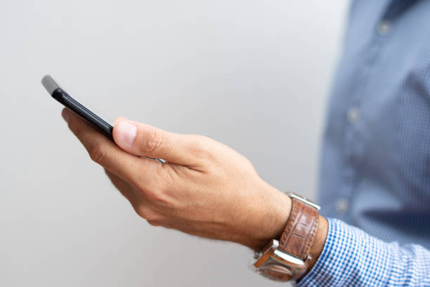 istock Closeup of manager holding smartphone 1067263464