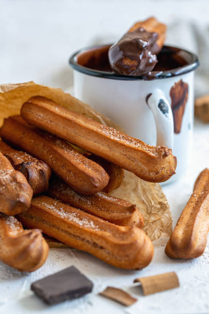 istock Traditional spanish churros dessert with hot chocolate. 1067267686