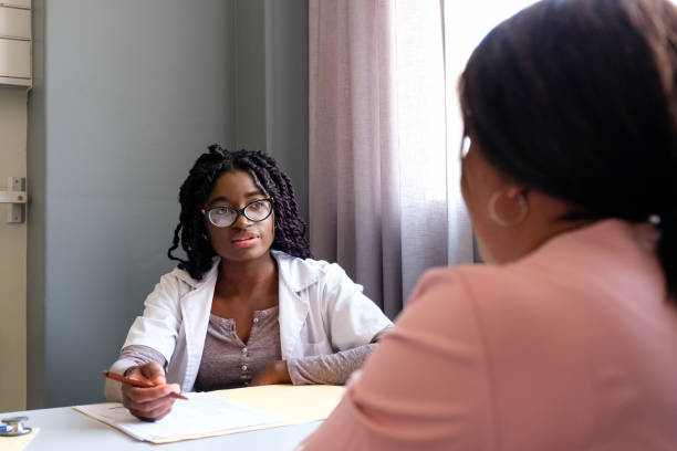 istock Female doctor with a senior patient 1067268930