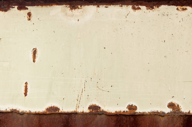 istock brown rusty metal sheet partially painted with light paint. grunge background with space for text or image 1067272760