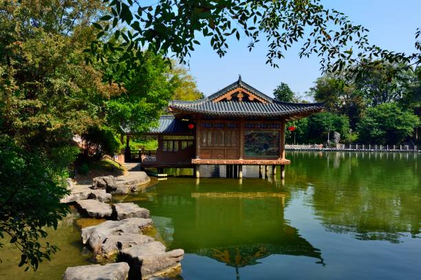 istock Pavilion and natural stone bridge in the lake 1067278050