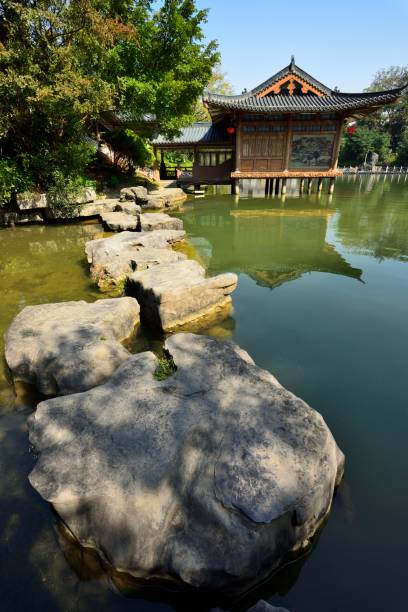 istock Pavilion and natural stone bridge in the lake 1067278062