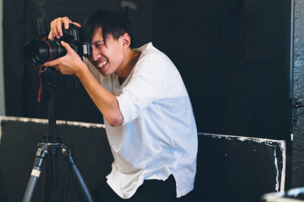 istock Professional photograher taking photos in his studio 1067278414