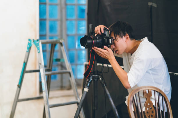 istock Professional photograher taking photos in his studio 1067279806