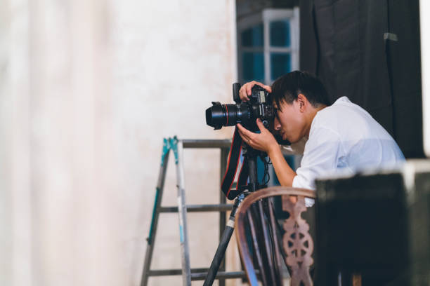 istock Professional photograher taking photos in his studio 1067285624