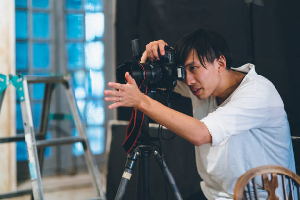 istock Professional photograher taking photos in his studio 1067286780