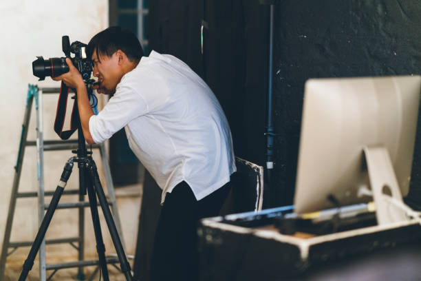 istock Professional photograher taking photos in his studio 1067287086