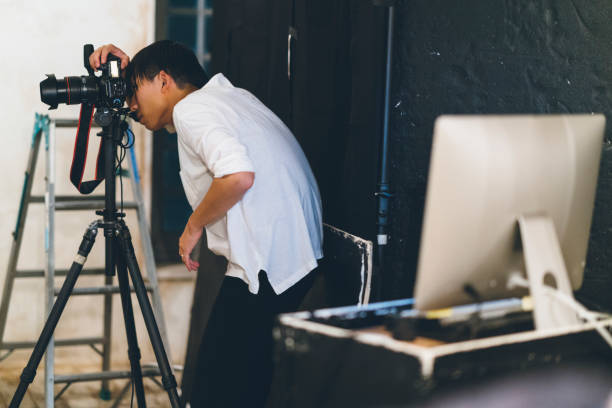 istock Professional photograher taking photos in his studio 1067287148