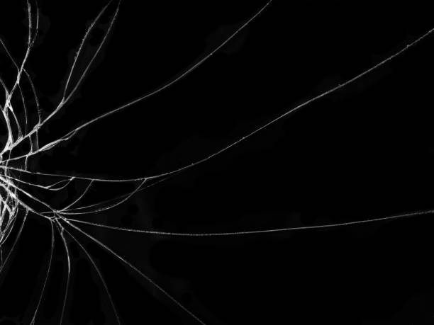 istock Cracked glass texture on black background 1067292312