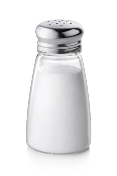 salt shaker on white background - salting imagens e fotografias de stock