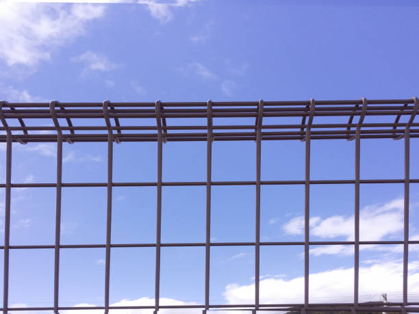 istock A blue sky looking over the fence 1067296574
