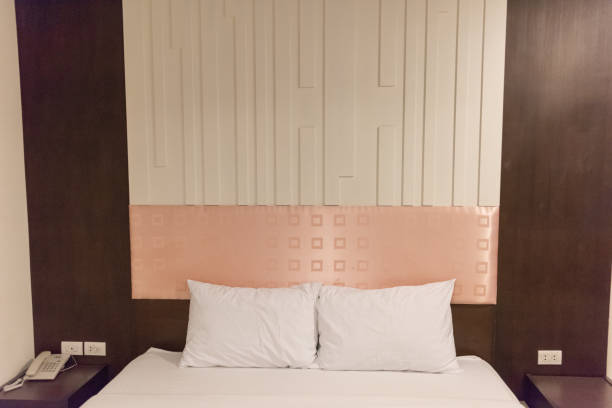 istock Hotel room Interior,Beautiful white pillow on bed decoration in bedroom interior 1067305974