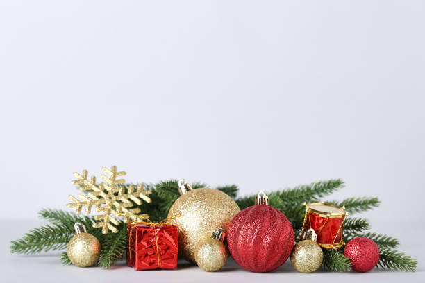 istock Christmas decorations with fir tree branches on gray background 1067307226