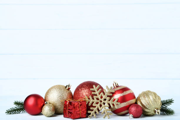 istock Christmas baubles with gift box and snowflake on wooden table 1067307640