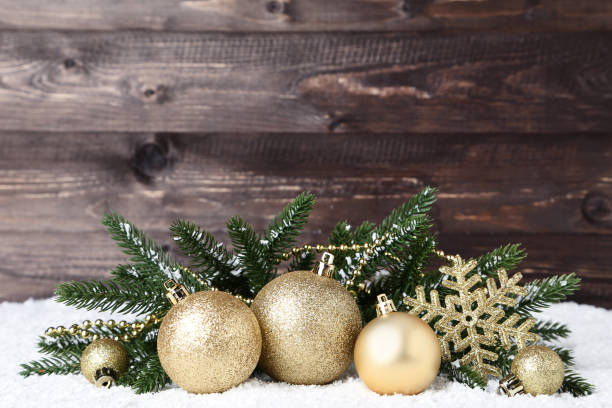 istock Christmas decorations with fir tree branches on wooden background 1067307724