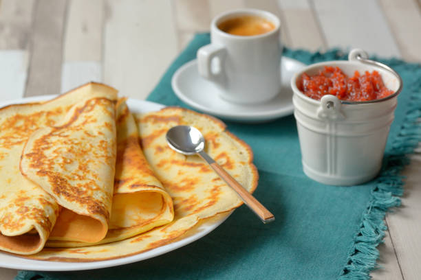 istock Pancakes with jam and Espresso on the wooden table 1067308108