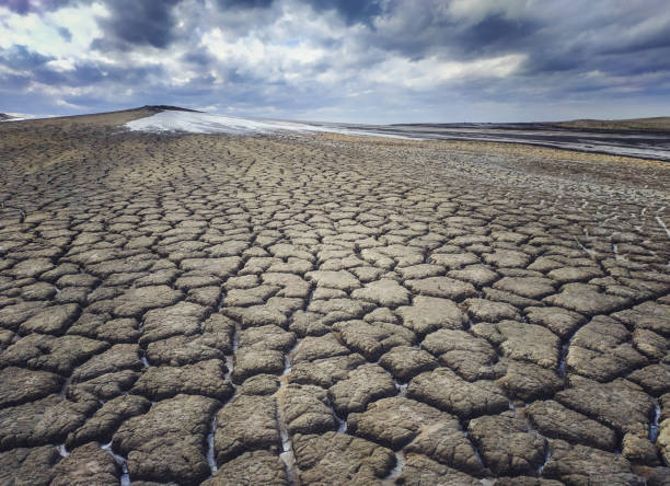 istock The surface around the mud volcano, cracked frozen mud 1067309448