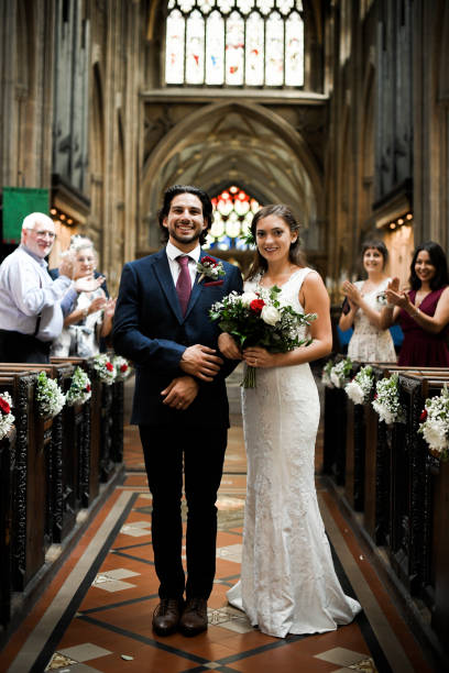 istock Newly wed couple walking down the aisle 1067309586