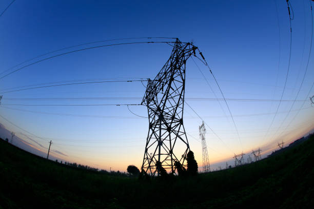 istock In the evening, high voltage towers silhouette 1067310150