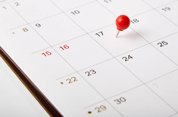 istock Red thumbtack a date 17th on calendar or planner 1067312224