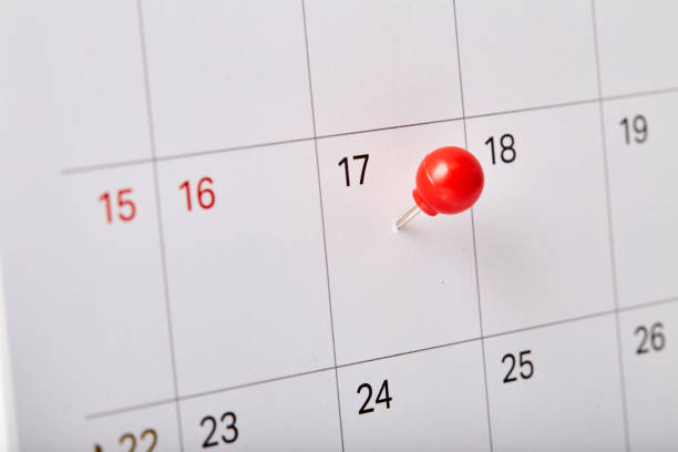 istock Red thumbtack a date 17th on calendar or planner 1067312356