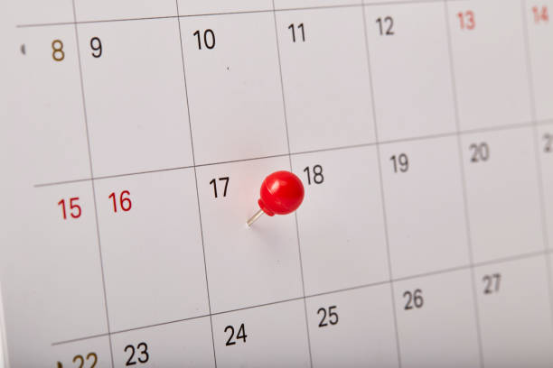 istock Red thumbtack a date 17th on calendar or planner 1067312560