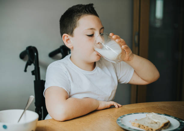 istock Boy drinking a glass of milk 1067313234