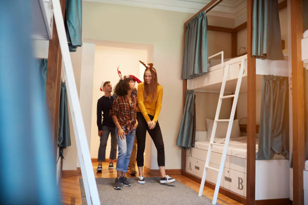 istock Young People Celebrating New Year in A Hostel 1067317580