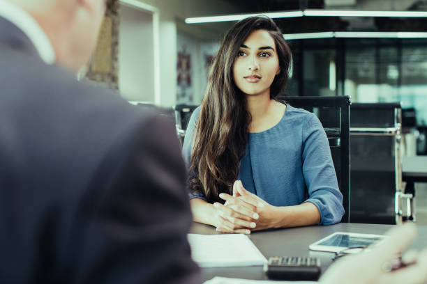 istock Focused Indian female customer meeting with financial advisor 1067319448