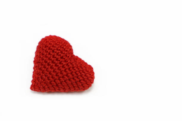 istock Red knitted heart isolated on white background 1067320056