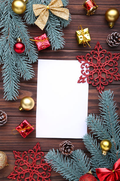 istock Christmas composition. Fir branches and christmas decor on a brown background 1067322018