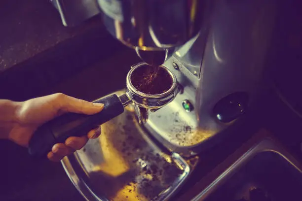 Grind coffee beans using a grinder