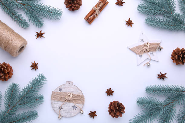 istock Fir tree branches with christmas toys on a white background 1067325932