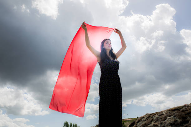 istock woman meditating in nature 1067327588
