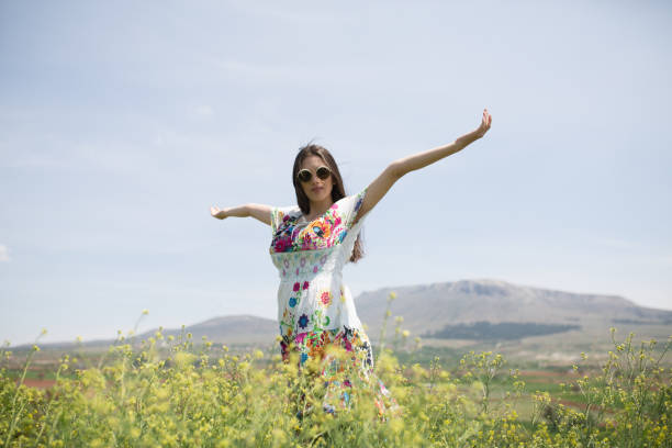 istock female model photography between flowers 1067327622