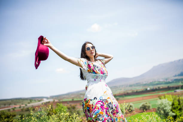 istock female model photography between flowers 1067327628