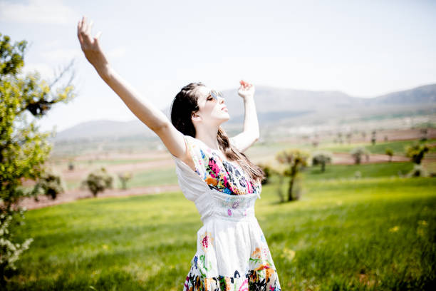 female model photography between flowers