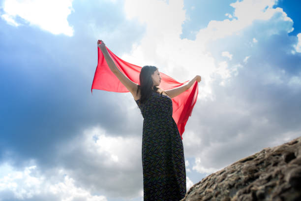 istock woman meditating in nature 1067330932