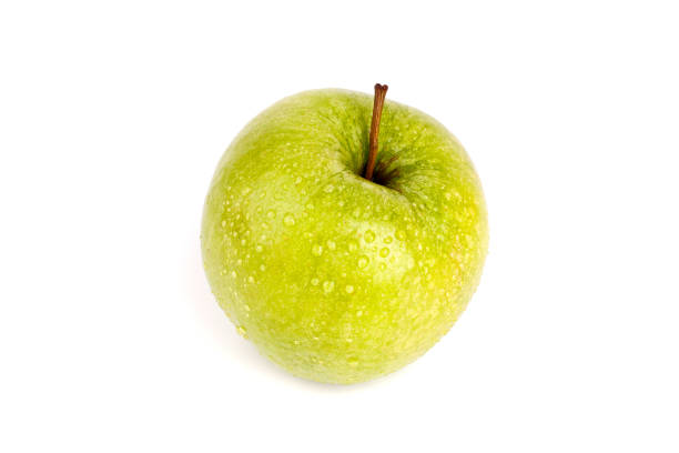 istock Fresh green apple in water drops on white background isolated close up macro 1067331376