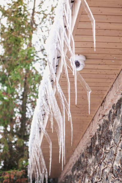istock Icicles of original form hang on roof 1067334078