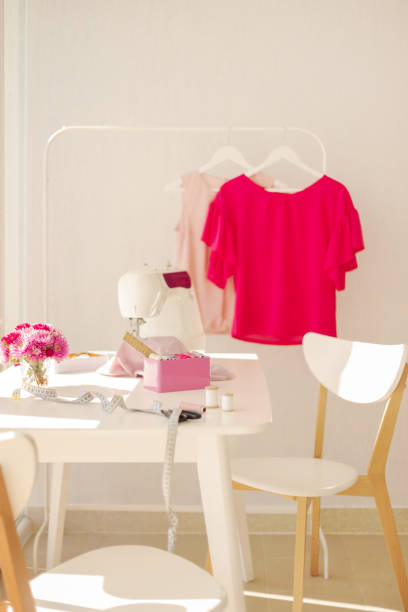 istock Workplace for sewing and needlework in a bright room with white furniture. 1067334542