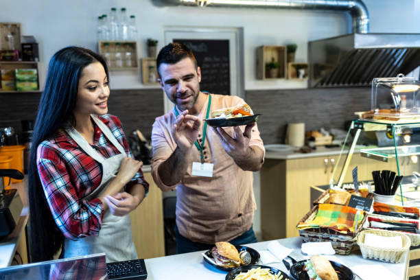 istock Chef showing how to present a meal 1067335204