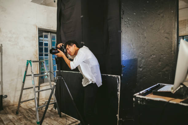 istock Professional photograher taking photos in his studio 1067348936