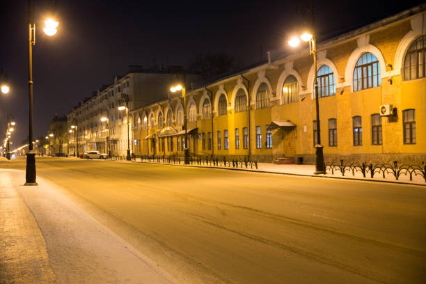 Snow blankets the rooftops of Saint Petersburg, capturing a somber winter cityscape amidst a heavy snowfall
