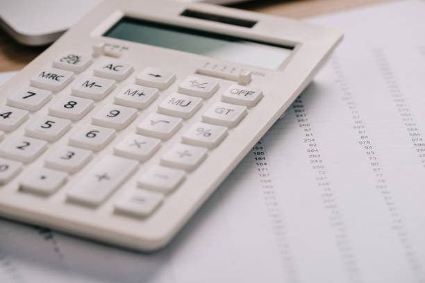 istock close up view of calculator and documents, acoounting concept 1067349142