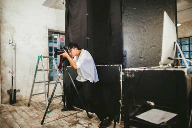 istock Professional photograher taking photos in his studio 1067349274