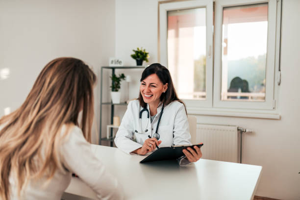 istock Young doctor and patient talking in the doctor's office. 1067351426